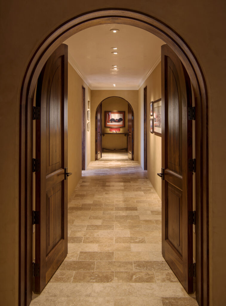 The Phil Nichols Company | Spanish Villa | Hallway with Arched Doors
