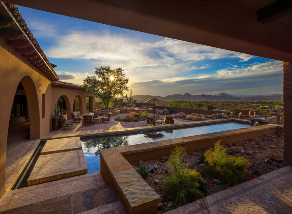 The Phil Nichols Company | Spanish Villa | Backyard Pool at Sunset