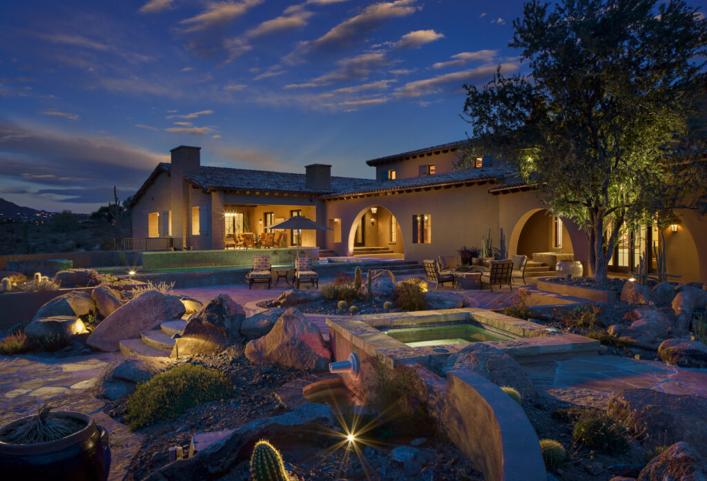 The Phil Nichols Company | Spanish Villa | Backyard with Evening Lighting